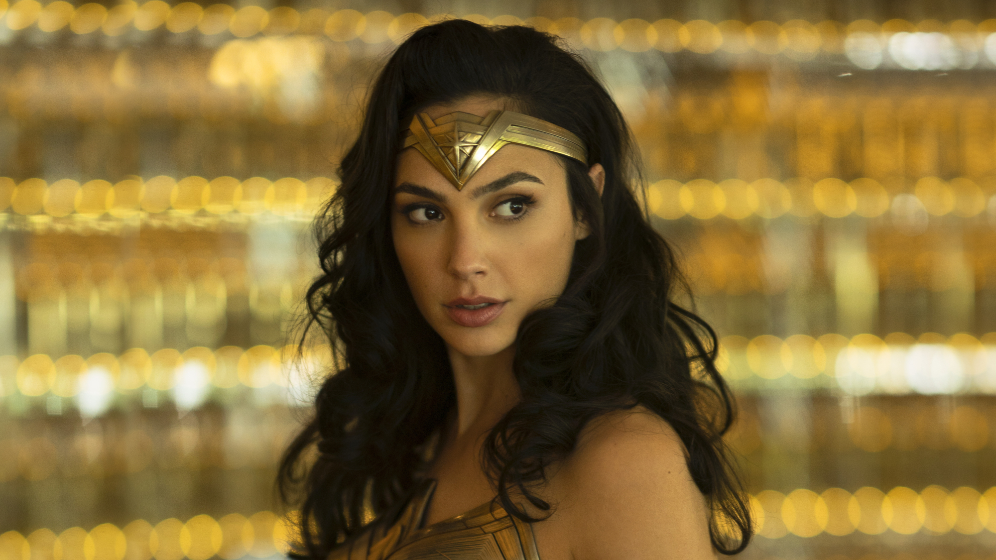 Diana Prince (Gal Gadot) looks over her shoulder in Wonder Woman 1984.