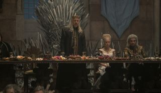 Viserys, Rhaenyra, and Laenor at the wedding feast in House of the Dragon