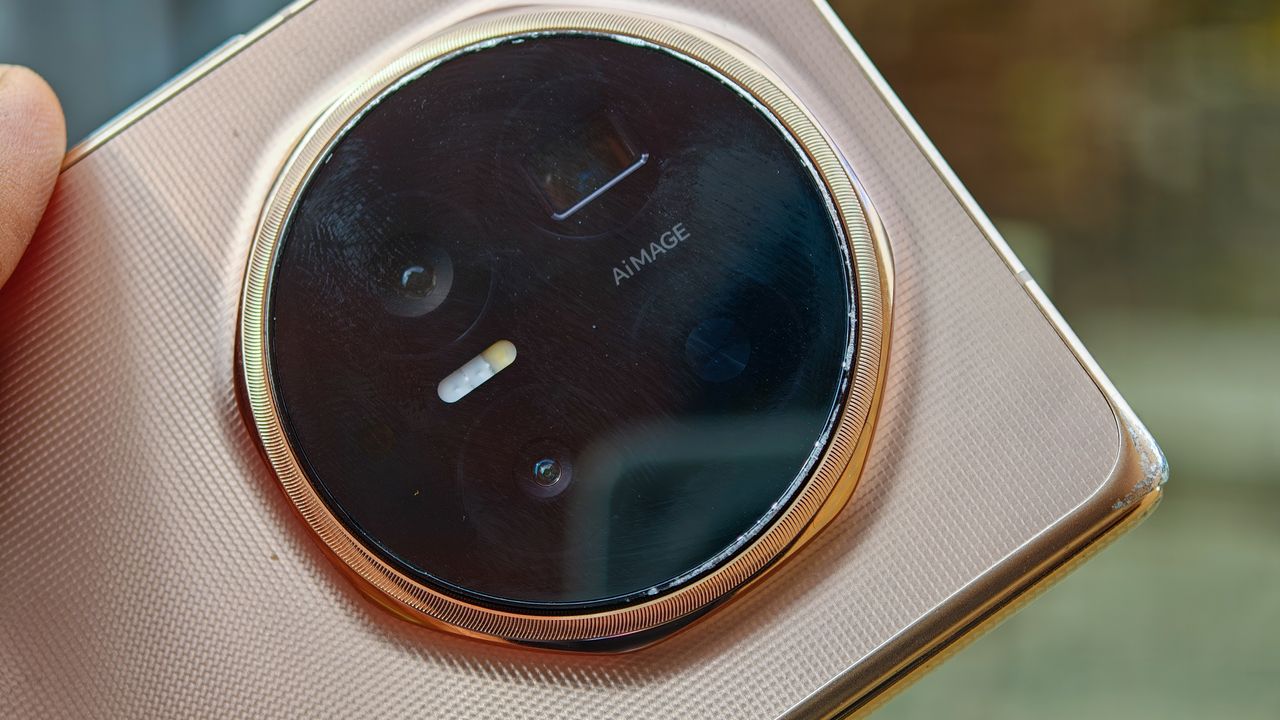 The Honor Magic V6 in gold after being put through a washing machine, complete with scratches and blemishes but fully working.