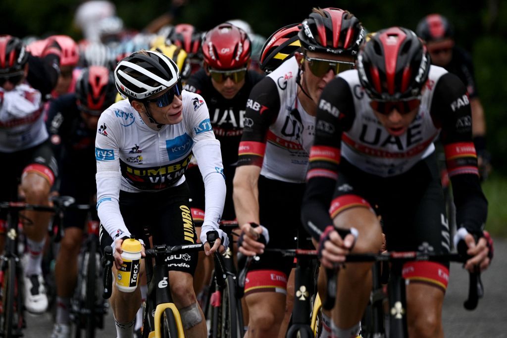 Team Jumbo Vismas Jonas Vingegaard of Denmark L wearing the best youngs white jersey rides in the pack during the 16th stage of the 108th edition of the Tour de France cycling race 169 km between Pas De La Case and SaintGaudens on July 13 2021 Photo by AnneChristine POUJOULAT AFP Photo by ANNECHRISTINE POUJOULATAFP via Getty Images