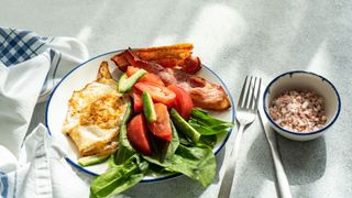 A selection of foods suitable for the Atkins diet, including eggs, spinach and vegetables