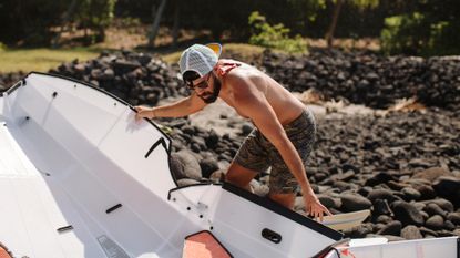 Man setting up Oru Kayak