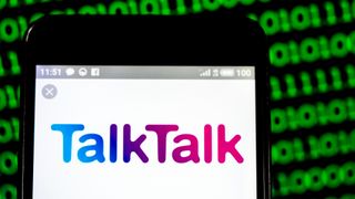 TalkTalk logo and branding pictured on a smartphone with binary code in background.