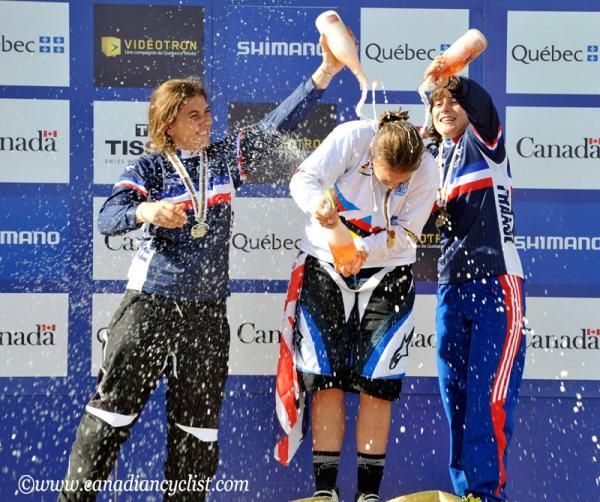 The girls get busy with the bubbly on the downhill podium