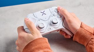A white Turtle Beach Victrix Pro BFG Reloaded controller for the PS5