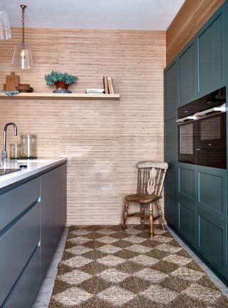 Galley kitchen with blue and teal cabinets