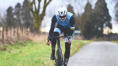 Image shows cyclist wearing kit sustainably 