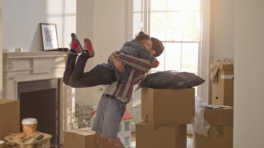 A couple celebrating moving in to a new home