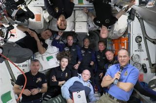 The four members of the Axiom-1 (Ax-1) private crew join the seven members of the International Space Station's Expedition 67 crew for a brief welcome ceremony on Saturday, April 9, 2022. From left to right: Roscosmos cosmonauts Sergey Korsakov and Denis Matveev, NASA astronauts Raja Chari (upside down) and Kayla Barron, Ax-1 mission specialists Mark Pathy of Canada and Eytan Stibbe of Israel, Roscosmos cosmonaut Oleg Artemyev, Ax-1 pilot Larry Connor, European Space Agency astronaut Matthias Maurer (upside down), Ax-1 commander Michael Lopez-Alegria and NASA astronaut Tom Marshburn.