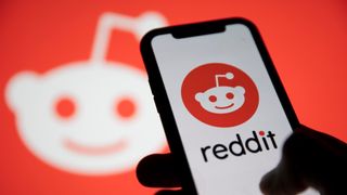 Reddit logo and Reddit logo on phone