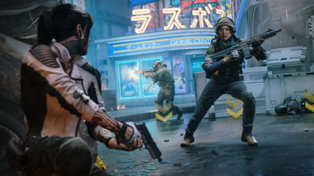 Black Ops 7 Drone Pods: Emma Karagan taking cover behind a car in a neon-lit street with a pistol at the ready while another soldier rounds the corner with an assault rifle.