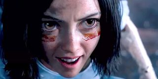 Alita smiles looks intense Alita: Battle Angel