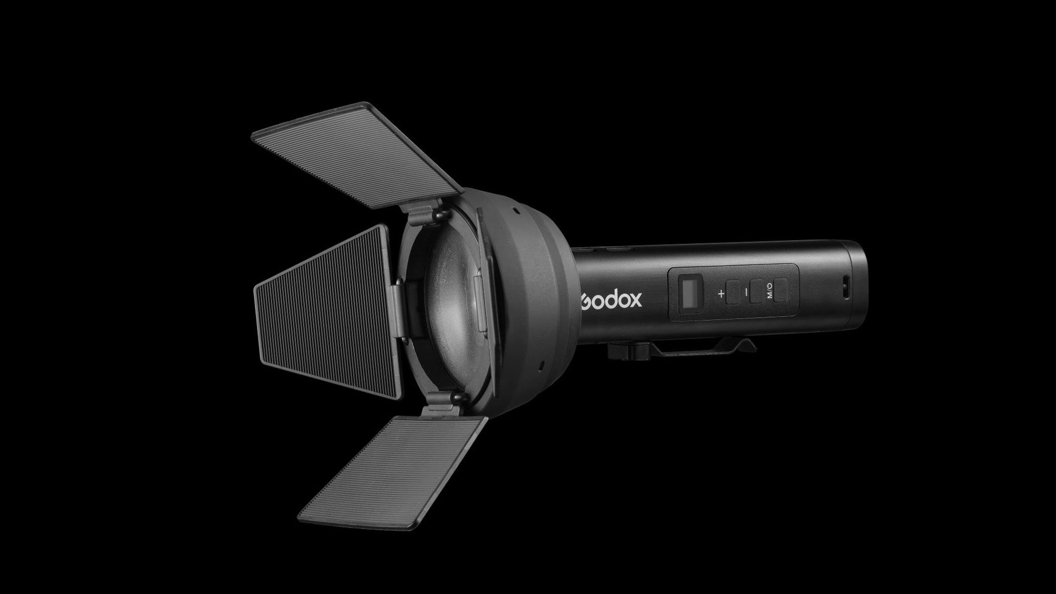 A flashlight-style studio light with a retractable hood.