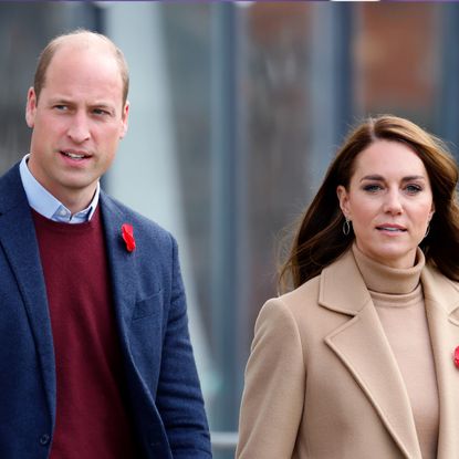 Prince William, wearing a red sweater and blue suit jacket, and Kate Middleton, wearing a camel coat and matching turtleneck sweater, visit Scarborough on November 3, 2022