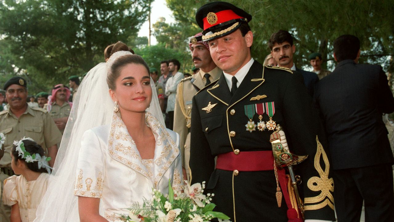 Prince Abdallah, the eldest son of Jordan's King Hussein, poses with his bride Rania Yassine after their wedding at the Royal