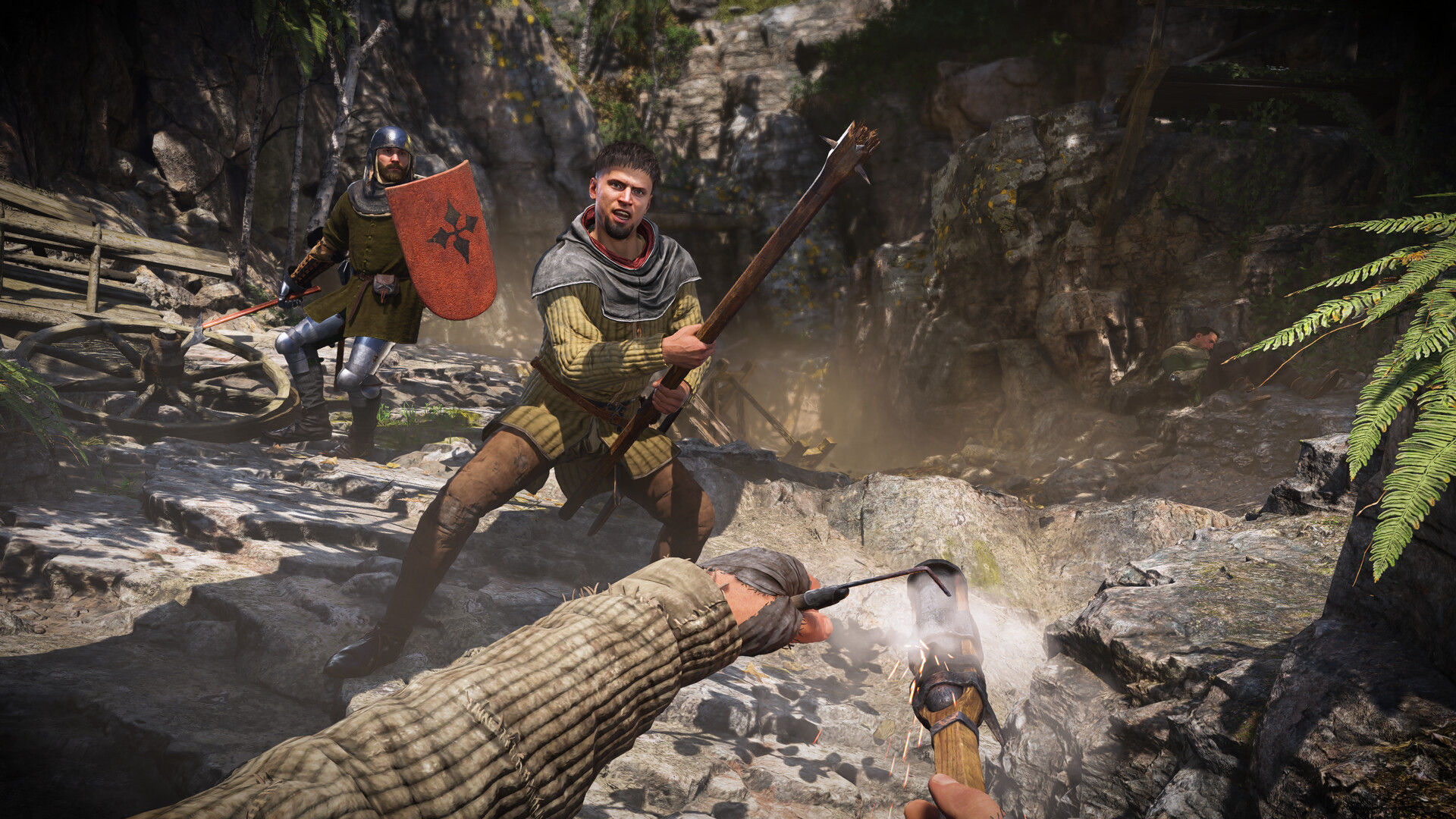 Henry lighting a torch while an enemy holds a large stick during Kingdom Come Deliverance 2.
