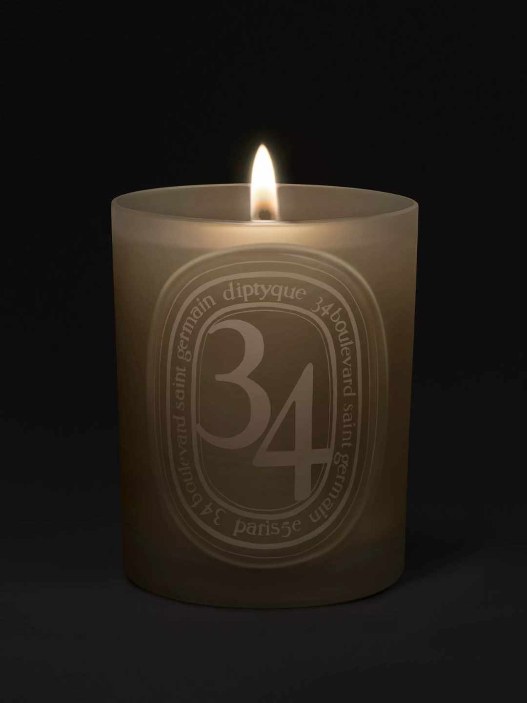 A frosted glass scented candle from Diptyque