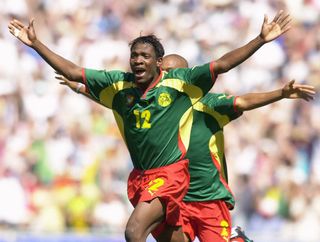 Lauren and Albert Meyong Ze celebrate after Cameroon's win against Spain in the final of the men's football tournament at the 2000 Olympic Games in Sydney.
