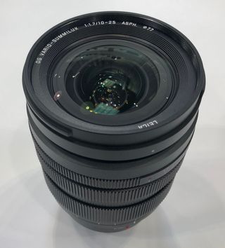The lens has a front filter ring with a 77mm thread