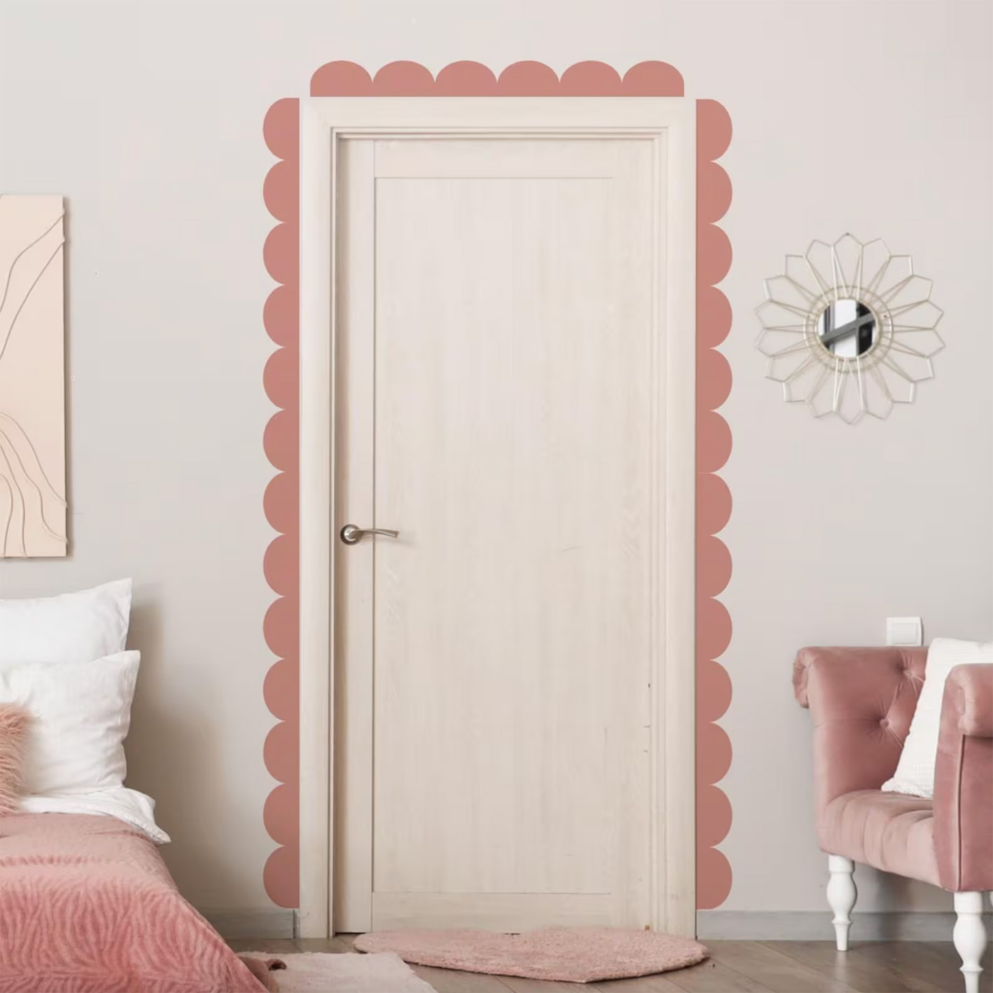 pink scallop border around a white door frame in room with pink decor