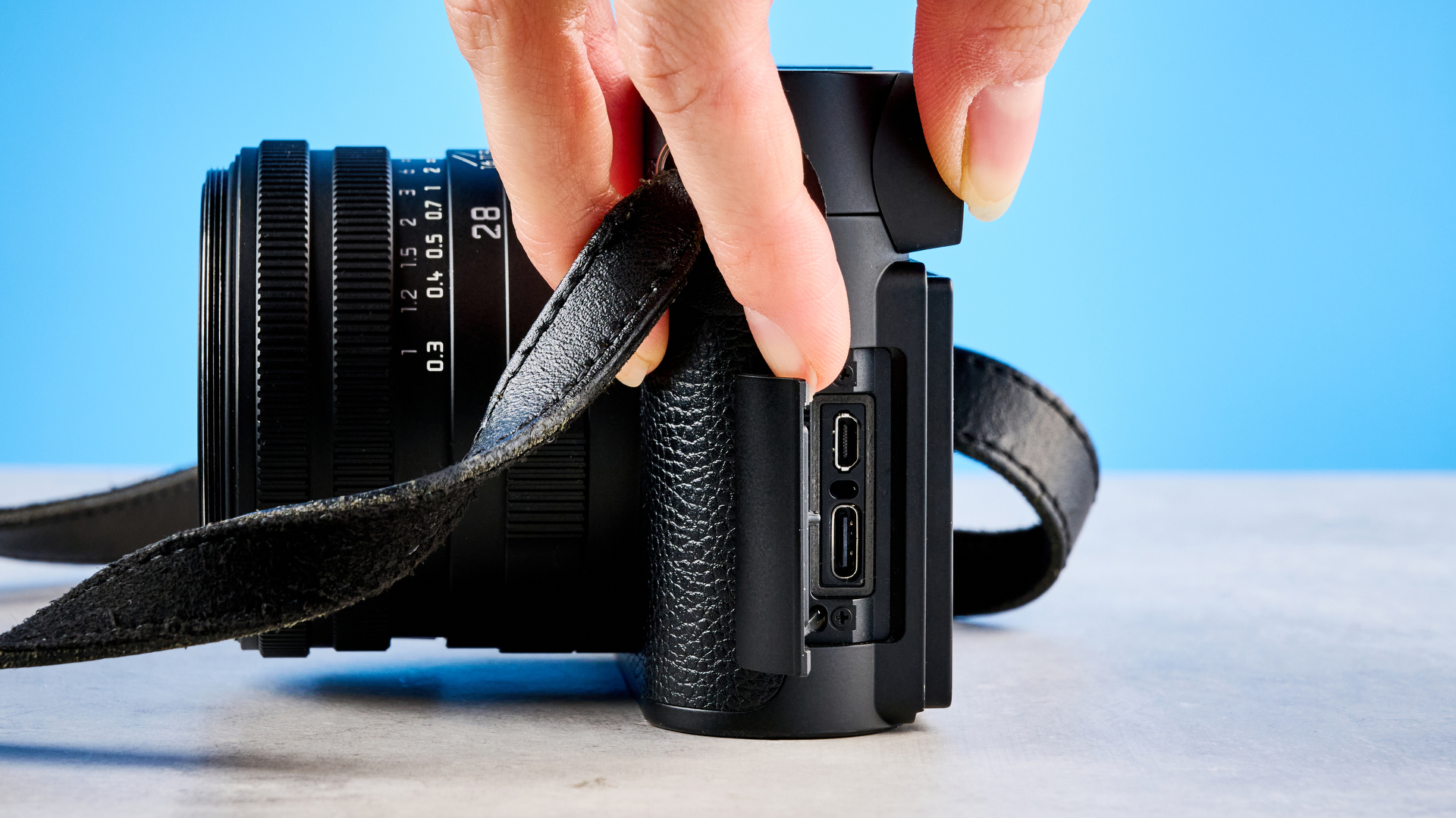 A black Leica Q3 Monochrom black-and-white mirrorless camera