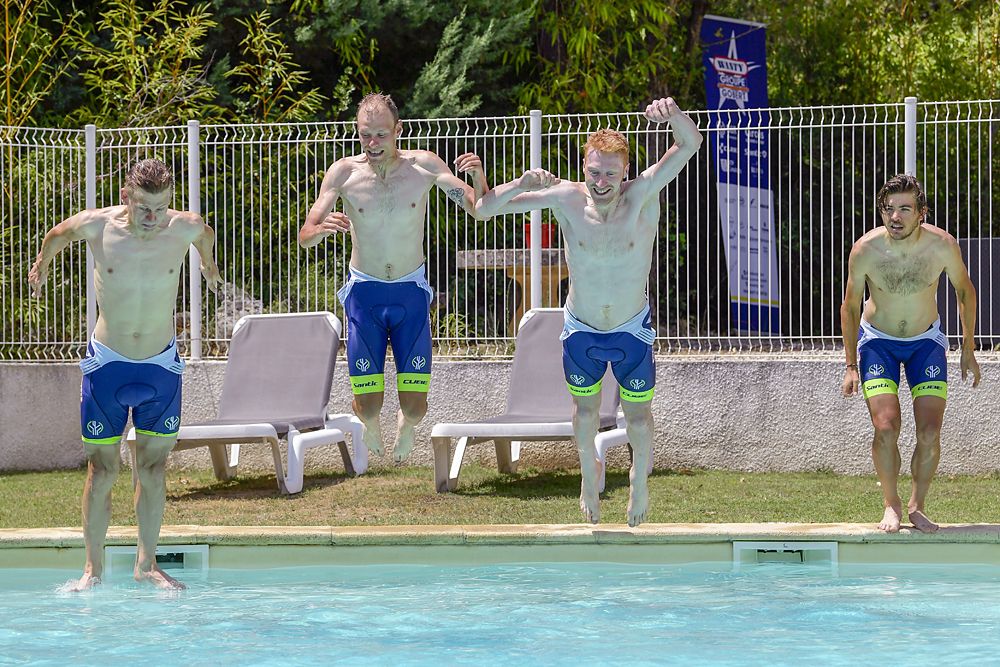 Wanty-Gobert Cycling team jump into the pool on a warm rest day at the Tour de France