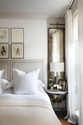 Relaxing bedroom idea Paul Raeside neutral bedroom with sheer curtains and mirrors