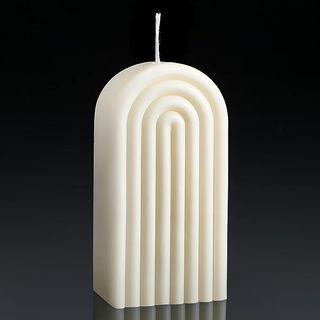 arched white pillar candle