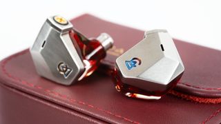 Campfire Audio Grand Luna in-ear monitors in silver on a red leather case