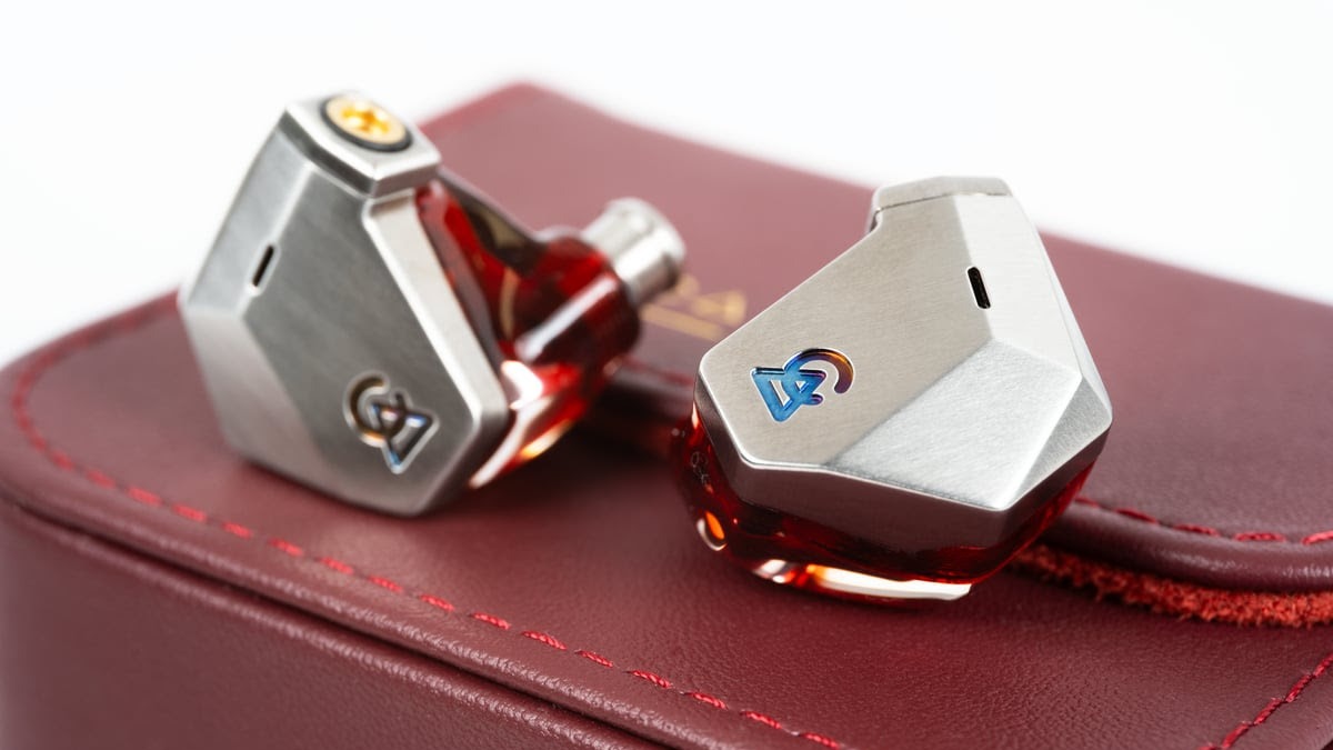 Campfire Audio Grand Luna in-ear monitors in silver on a red leather case