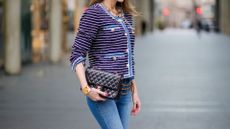 woman wearing chanel jacket and jeans street style