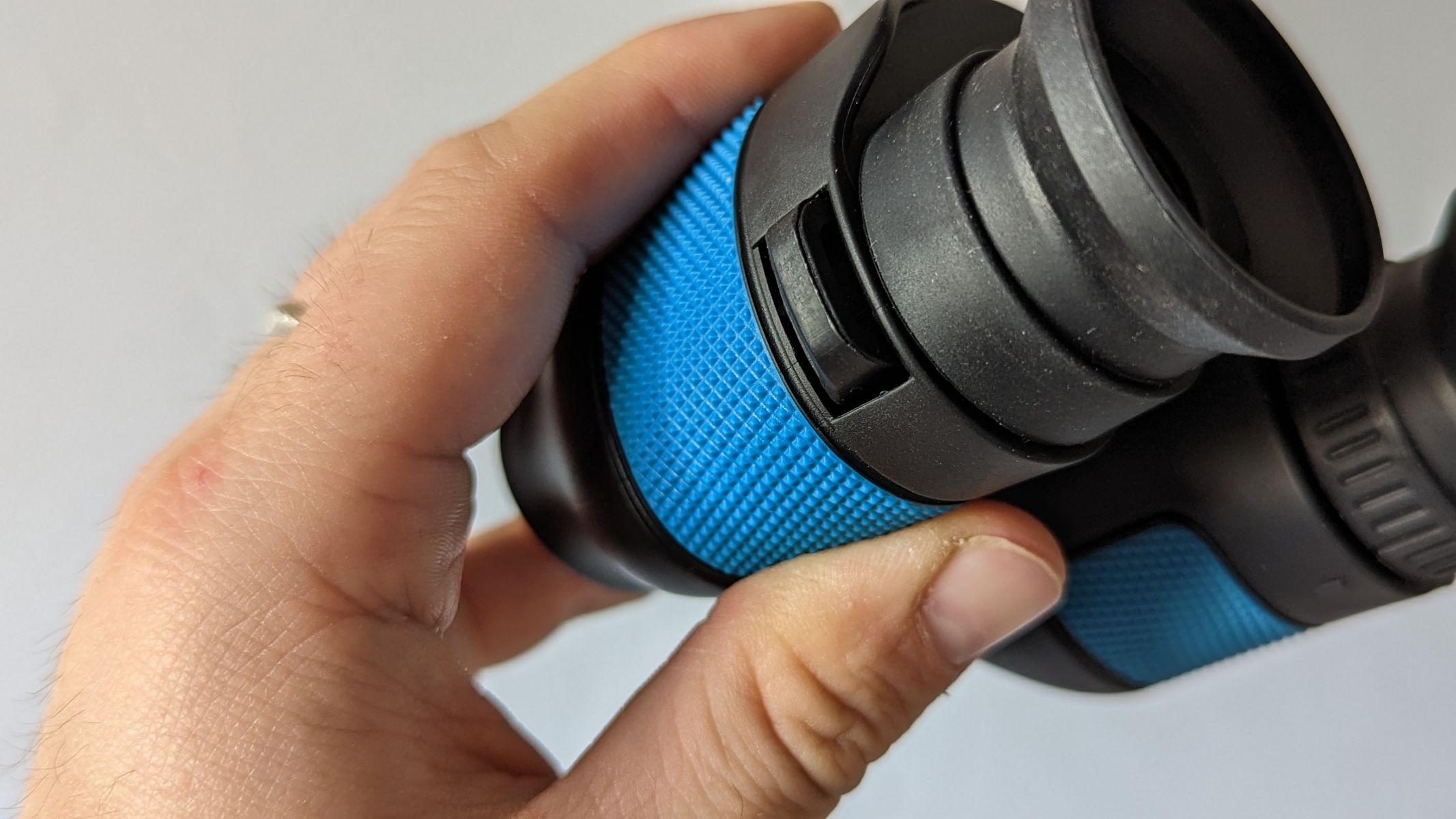 Occer 12x25 binoculars close-up of textured grip