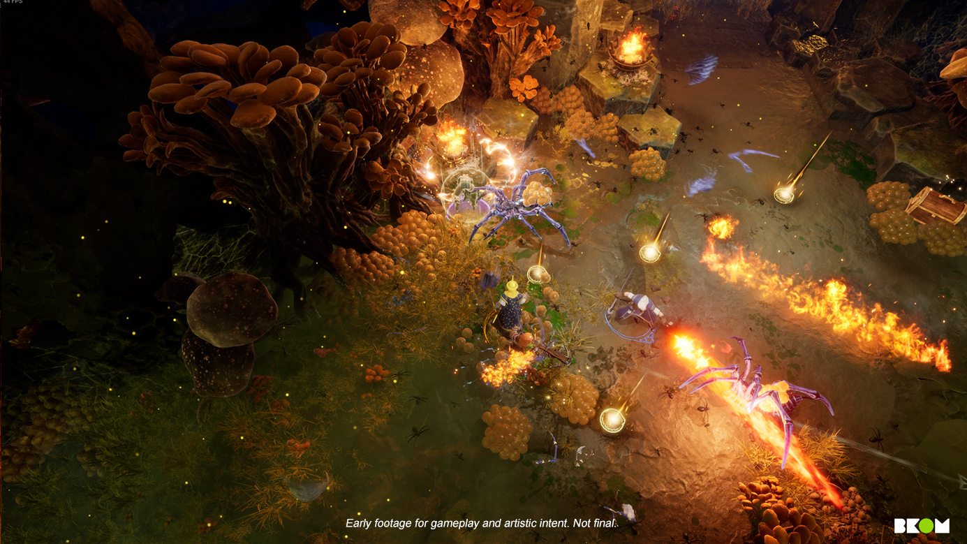The player and their crew use fire magic to torch spider enemies from a top-down isometric view