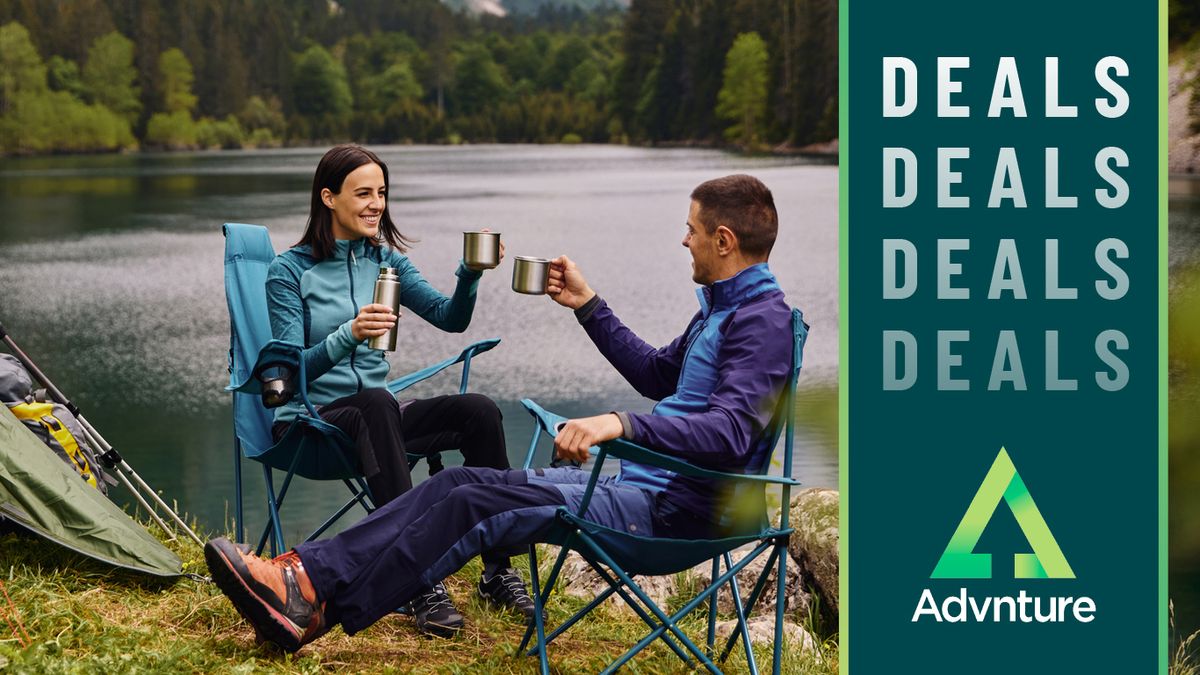 Couple drinking coffee at camp