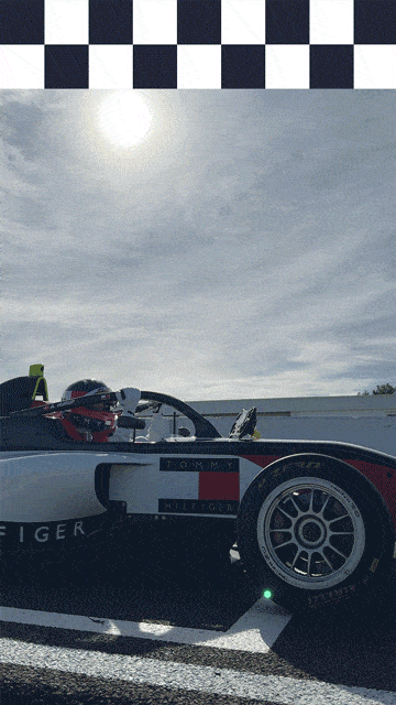 gif of Alba Hurup Larsen climbing into an F1 car
