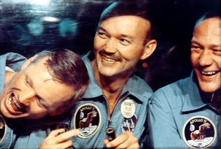 Neil Armstrong, Michael Collins and Buzz Aldrin laughing while in quarantine after the Apollo 11 mission.