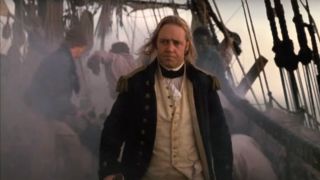 Russell Crowe strides through chaos on his ship in Master and Commander: Far Side of the World.