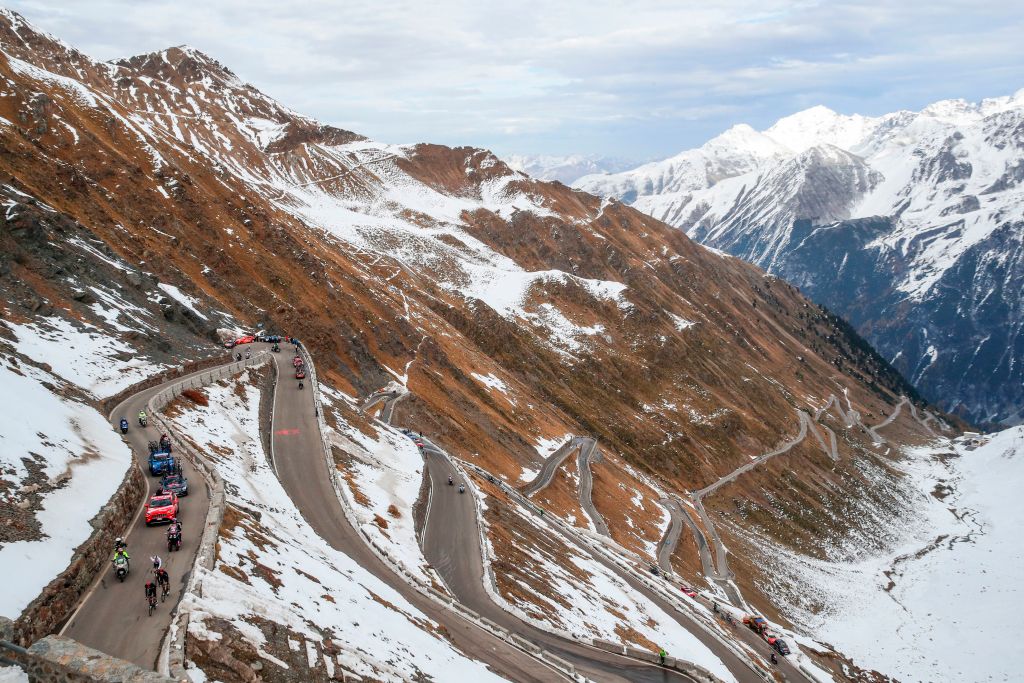 Cyclists ride uphill at the Passo dello Stelvio Stelvio Pass during the 18th stage of the Giro dItalia 2020 cycling race a 207kilometer route between Pinzolo and Laghi di Cancano on October 22 2020 Photo by Luca Bettini AFP Photo by LUCA BETTINIAFP via Getty Images