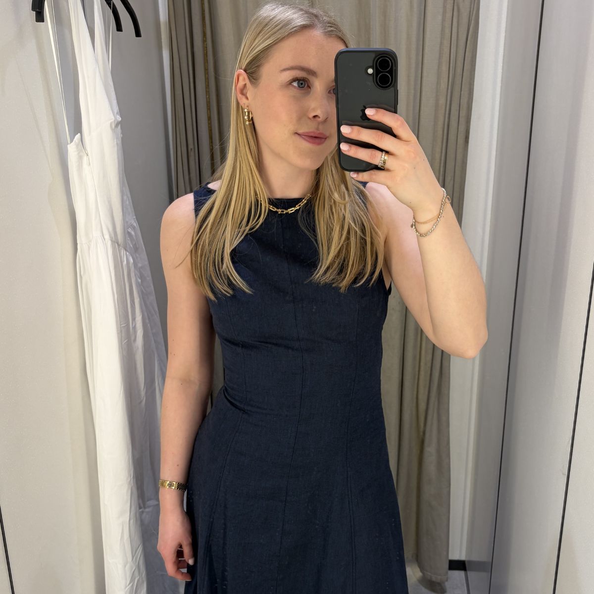 Woman wears navy dress