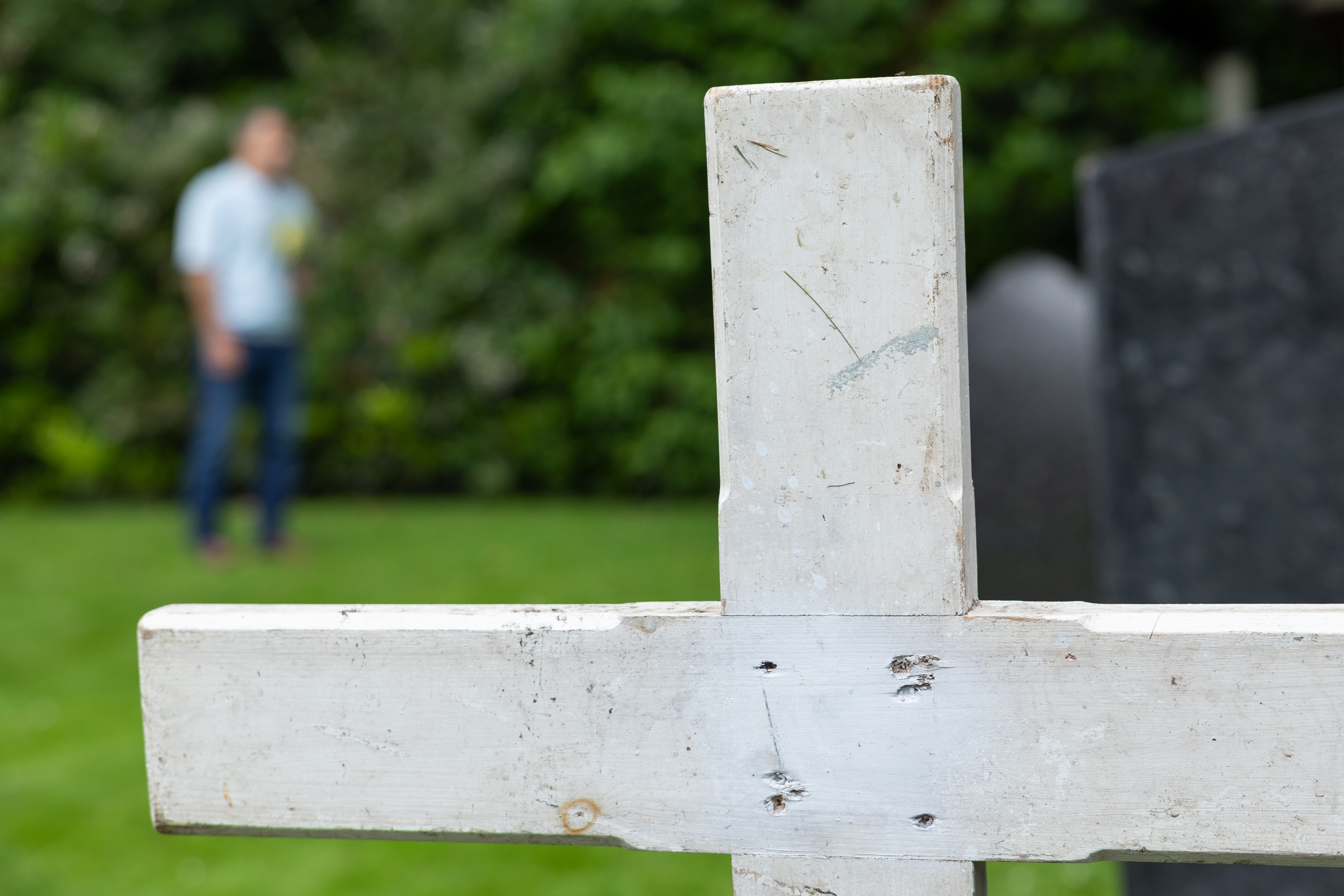 A gravestone in a cemetary.