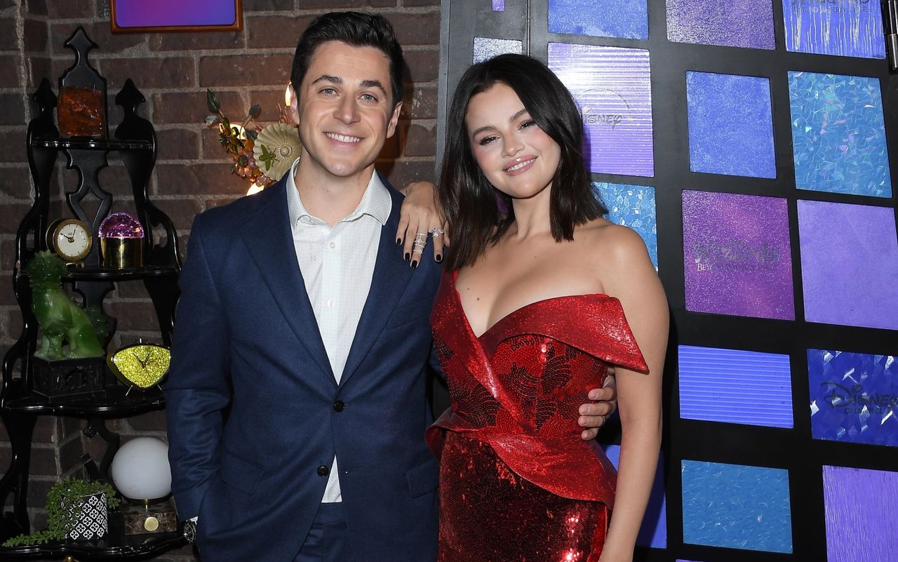 Selena Gomez at a wizards of waverly place event in a red sequin dress