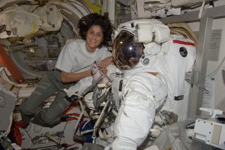 NASA astronaut Sunita Williams poses with her spacesuit aboard the International Space Station ahead of a spacewalk during the Expedition 32 mission.