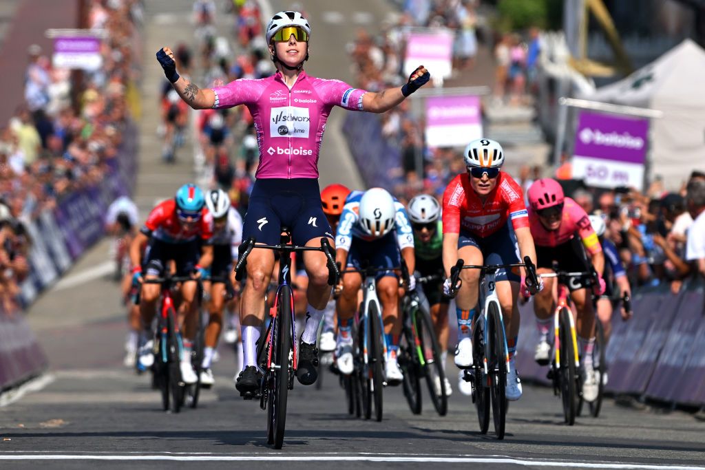 KNOKKEHEIST BELGIUM JULY 18 LR Lorena Wiebes of The Netherlands and Team SD Worx Protime Purple Leader Jersey celebrates at finish line as stage winner ahead of Charlotte Kool of The Netherlands and Team dsmfirmenich PostNL Red points Jersey during the 10th Baloise Ladies Tour 2024 Stage 1 a 1138km stage from Breskens to KnokkeHeist on July 18 2024 in KnokkeHeist Belgium Photo by Luc ClaessenGetty Images