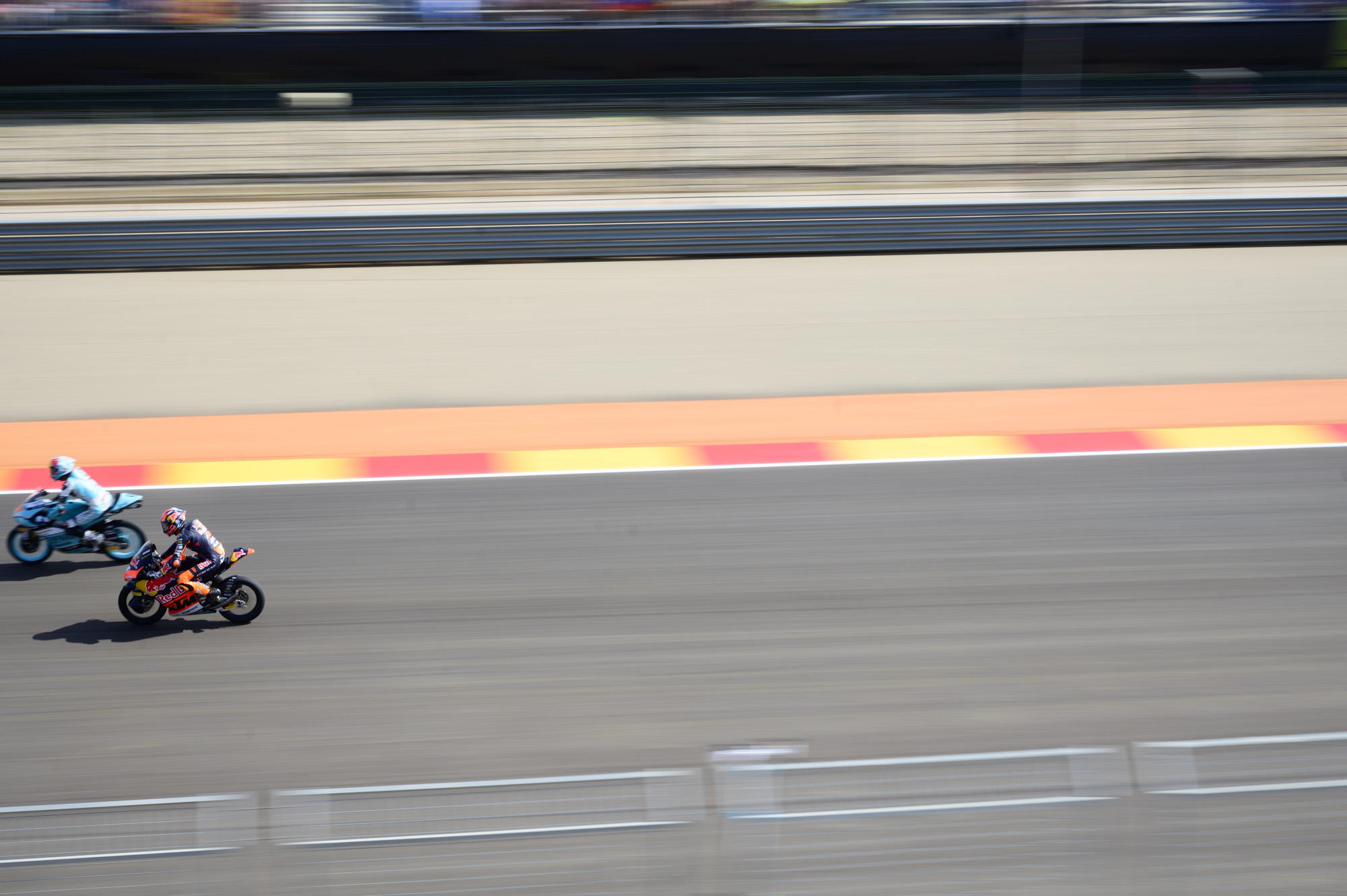 MotoGP racetrack with motorbike riders at full speed