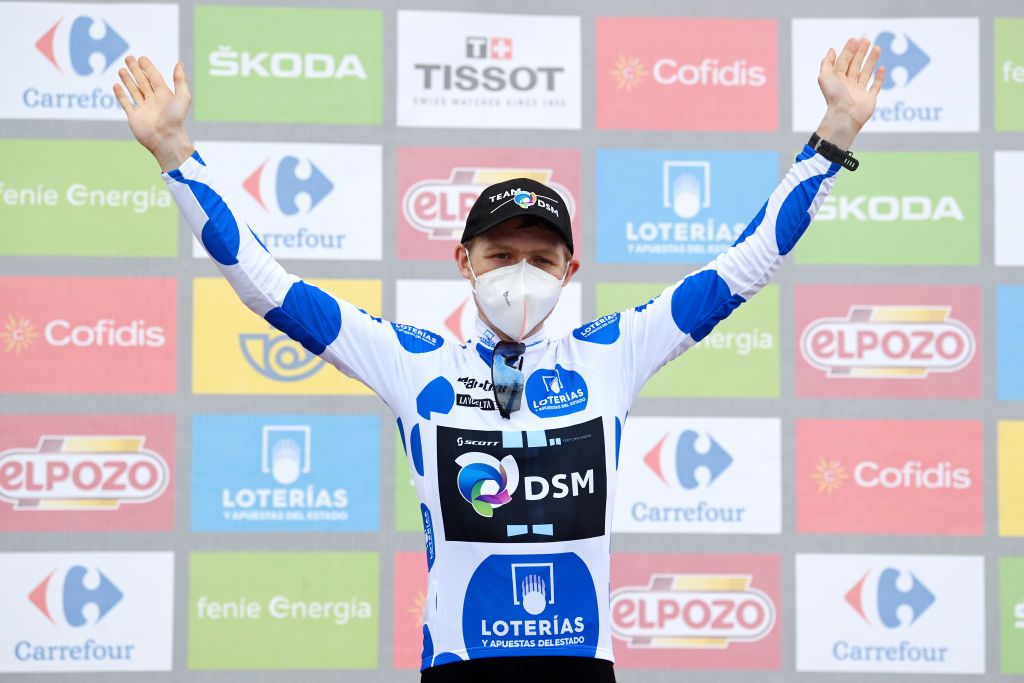 ALTU DEL GAMONITEIRU SPAIN SEPTEMBER 02 Michael Storer of Australia and Team DSM celebrates winning the polka dot mountain jersey on the podium ceremony after the 76th Tour of Spain 2021 Stage 18 a 1626km stage from Salas to Altu dEl Gamoniteiru 1770m lavuelta LaVuelta21 on September 02 2021 in Altu dEl Gamoniteiru Spain Photo by Stuart FranklinGetty Images