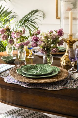 spring themed table decor with cabbage plates and fresh flowers on the table