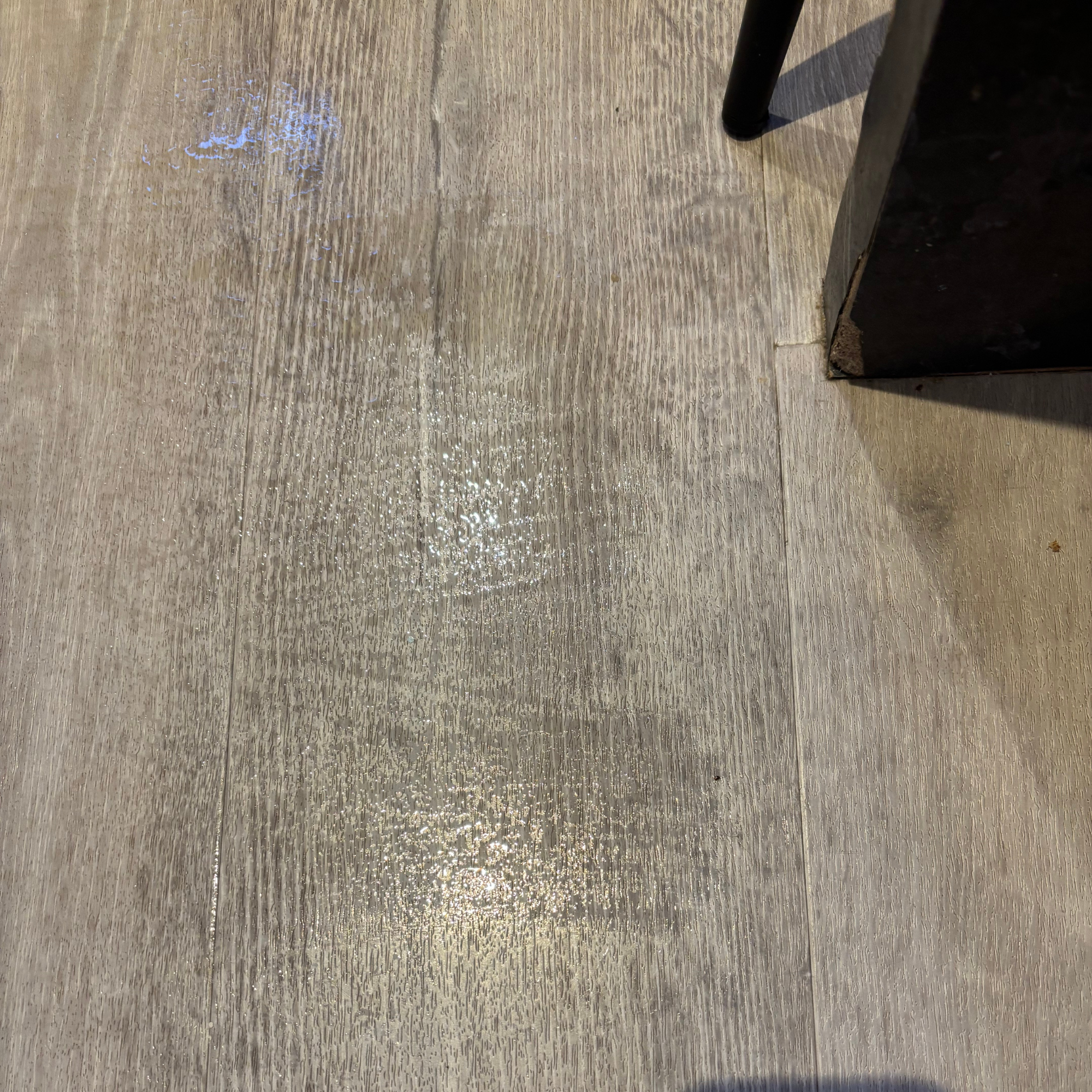 Visible water marks on laminate flooring