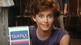 Courteney Cox holding Tampax box in Tampax ad