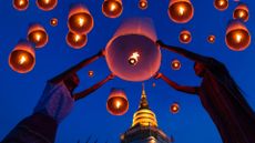 Thai people floating a lamp in Yee Peng festival in Chiang Mai,Thailand.