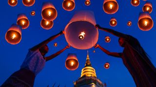 Thai people floating a lamp in Yee Peng festival in Chiang Mai,Thailand.